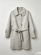 Light gray wool coat with a notched collar, button front, raglan sleeves and tie belt