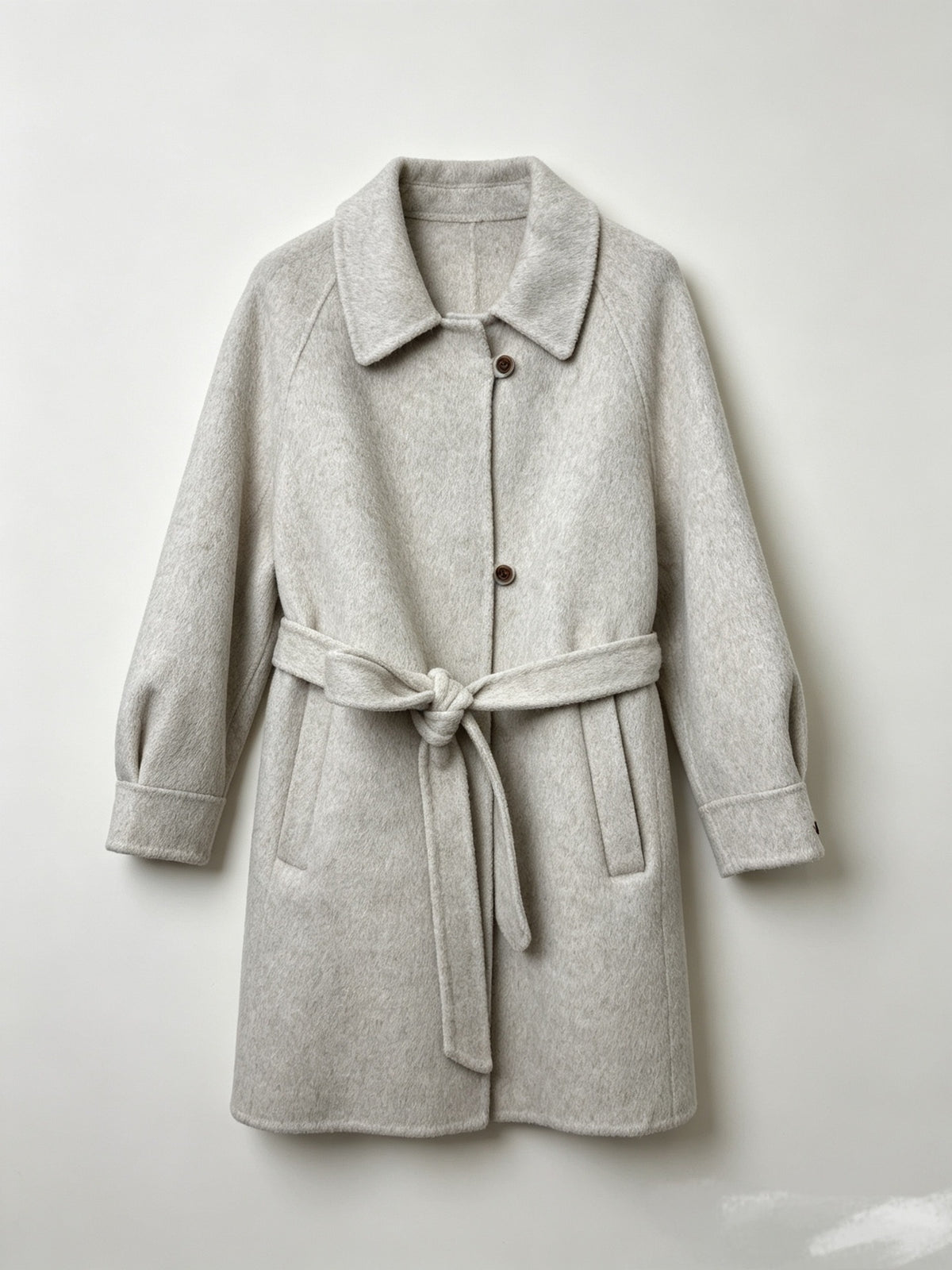 Light gray wool coat with a notched collar, button front, raglan sleeves and tie belt