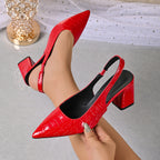 Red croc-embossed slingback pumps with pointed toe and block heel.