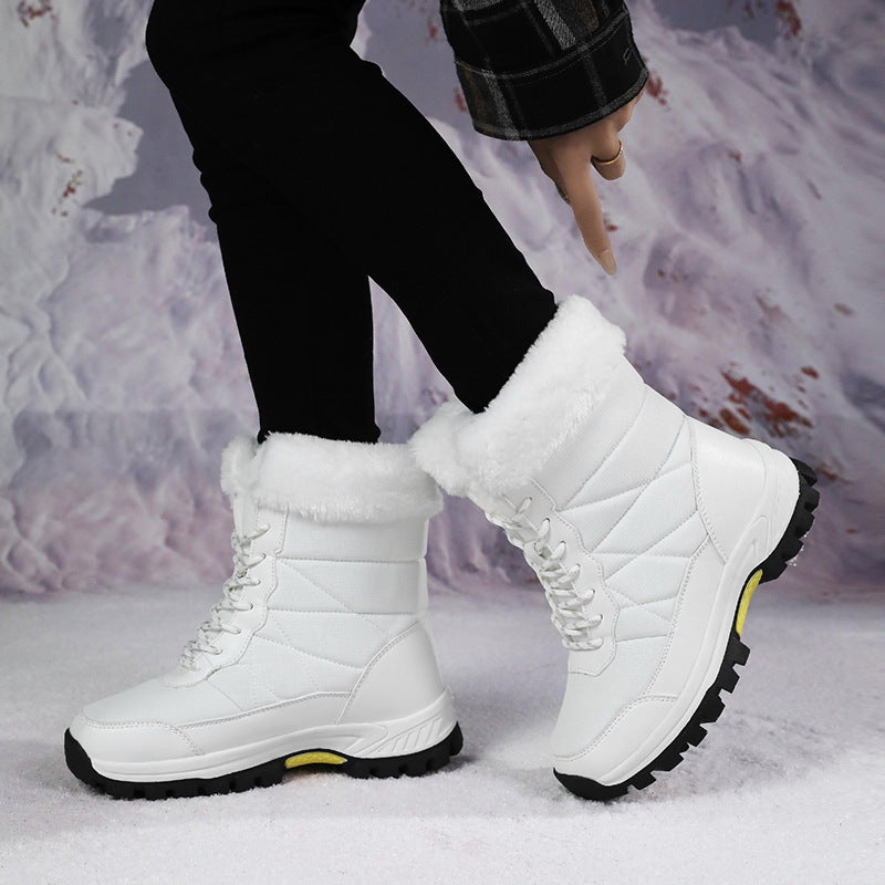 Women’s mid-calf faux fur lace-up snow boots in white, quilted upper and lug sole