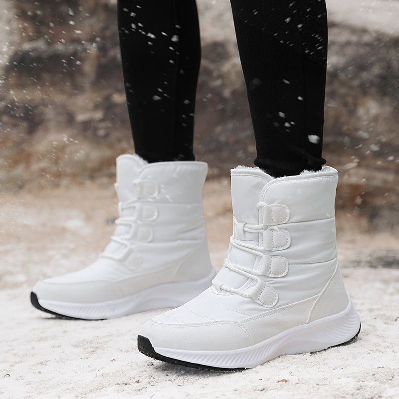 Women's fleece-lined snow boots, white high-top with hook-and-loop straps and grippy sole