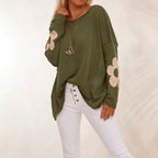 Olive green oversized knit sweater with flower motifs and drop shoulders