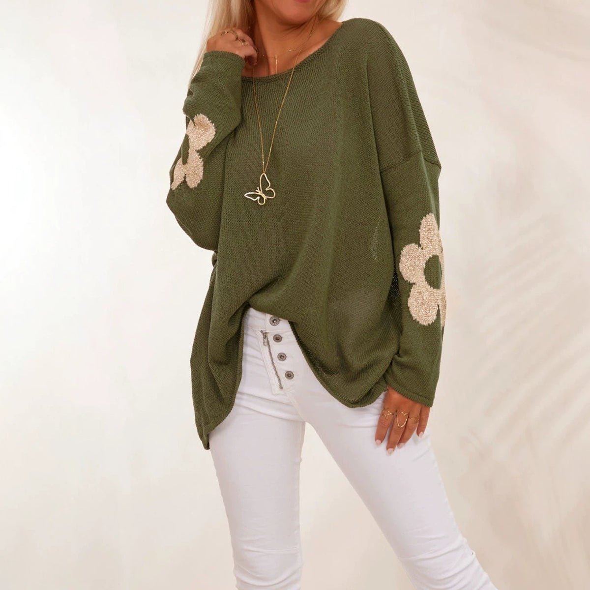 Olive green oversized knit sweater with flower motifs and drop shoulders