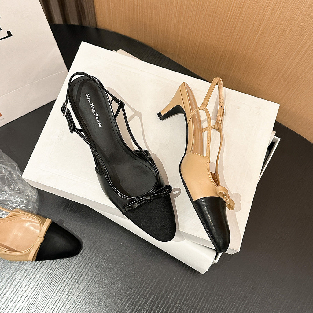 Black and beige slingback kitten heel pumps with bow accents and cap toes