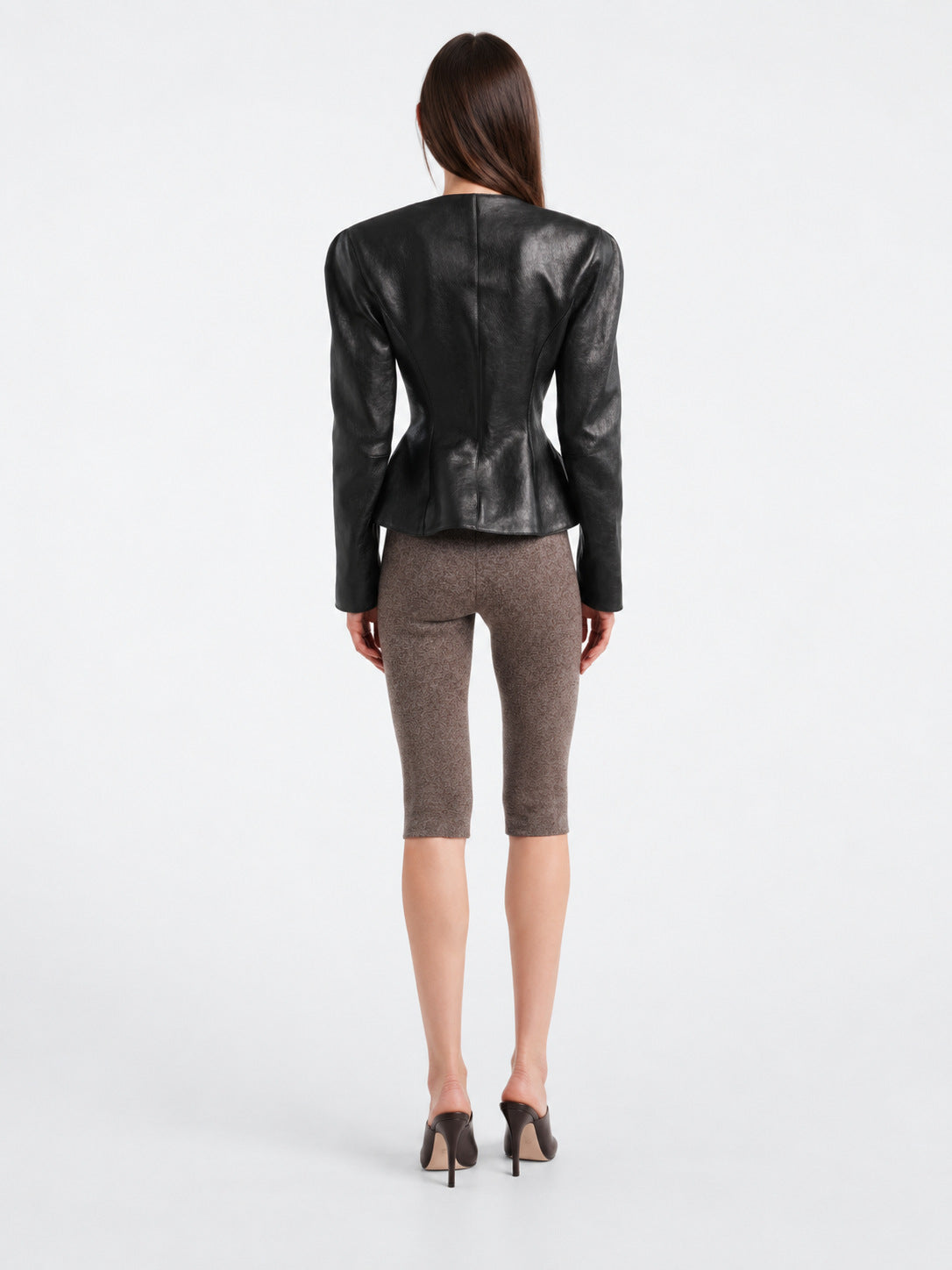 Black faux leather blazer jacket, back view with center seam and buttonless back
