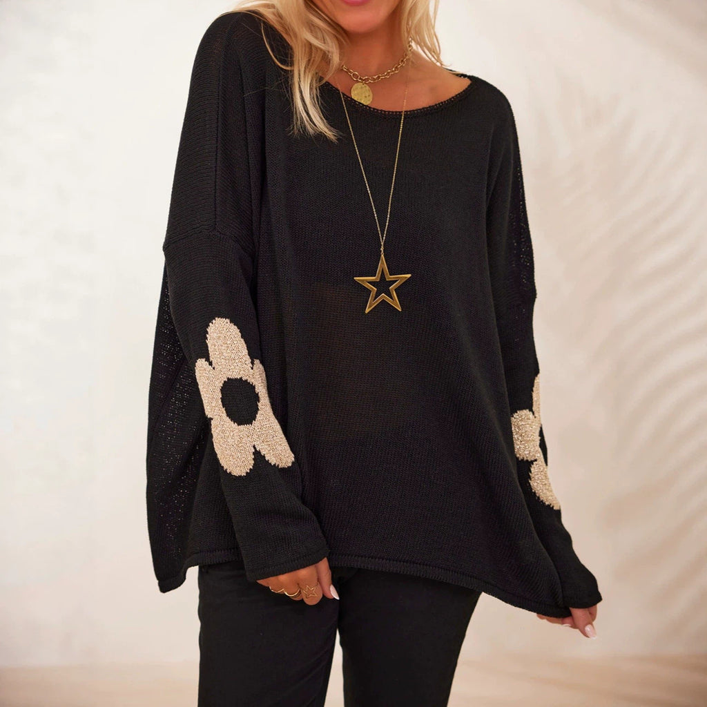 Women's black oversized knit sweater with flower motifs and drop shoulders