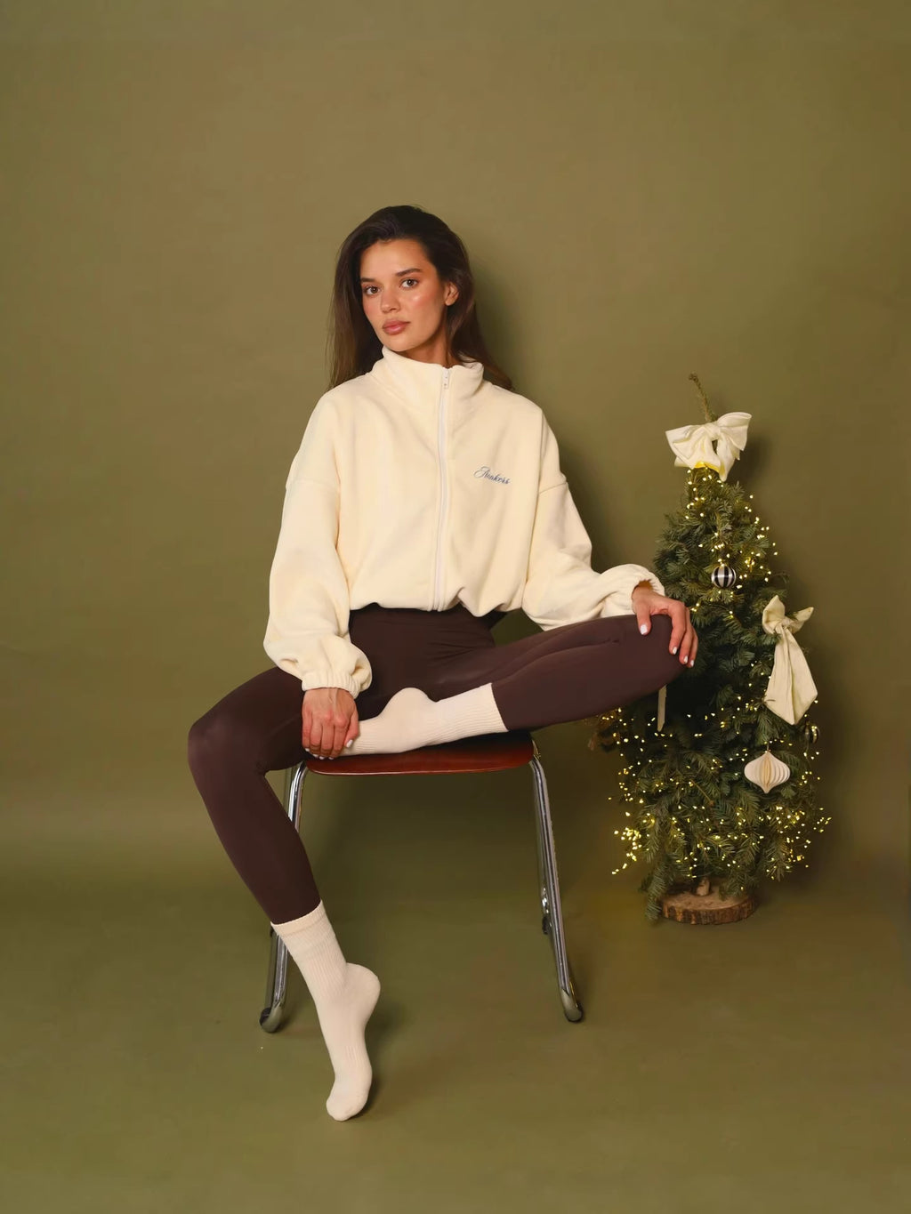 Light yellow cropped fleece jacket, full zip stand collar and drawstring hem