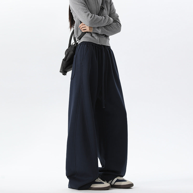 Women's navy barrel-leg lounge pants with elastic waist and drawstring ties