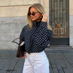 Navy polka dot cropped puffer jacket with stand collar and zip front