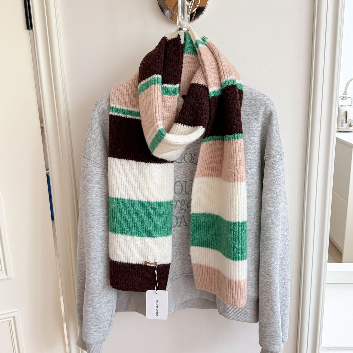 Women’s long striped wool scarf, wide knit stripes in brown, cream, and green.