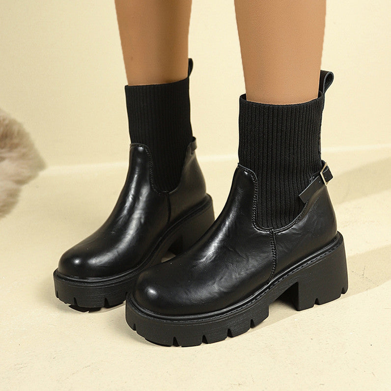 Black ribbed sock-booties with chunky lug sole and side buckle detail