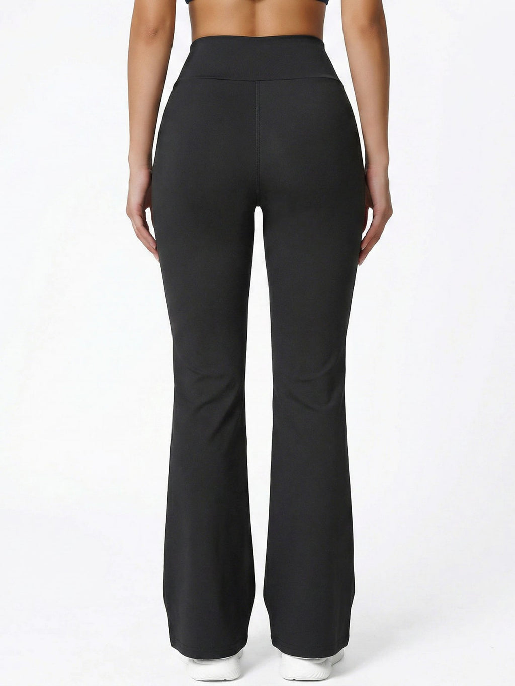 Black high-waisted bootcut yoga pants, rear view from behind