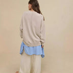 Oversized crewneck sweatshirt in light beige with exposed seams and side-slit hem