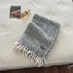 Boucle knit scarf, light gray with long fringe tassels and small logo patch