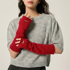 Red fingerless knit arm warmers with thumbhole, soft wool-blend cuff detail