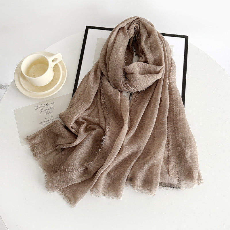 Women’s cotton scarf in taupe, long crinkle gauze with frayed fringe ends