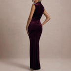 Burgundy velvet maxi dress with sleeveless mock neck and ruched fitted bodice, long slit