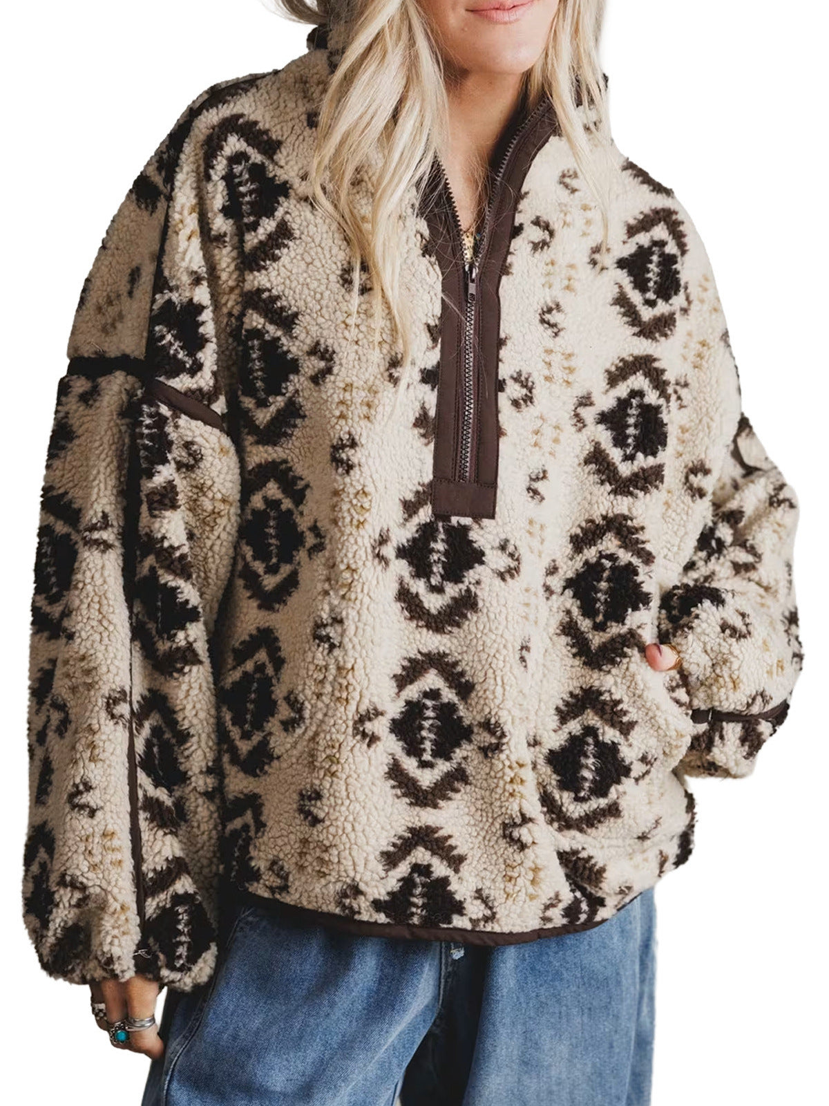 Cream sherpa quarter-zip pullover with aztec pattern, long sleeves, pocket