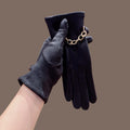 Black faux suede gloves with gold chain-link cuff, full-finger design