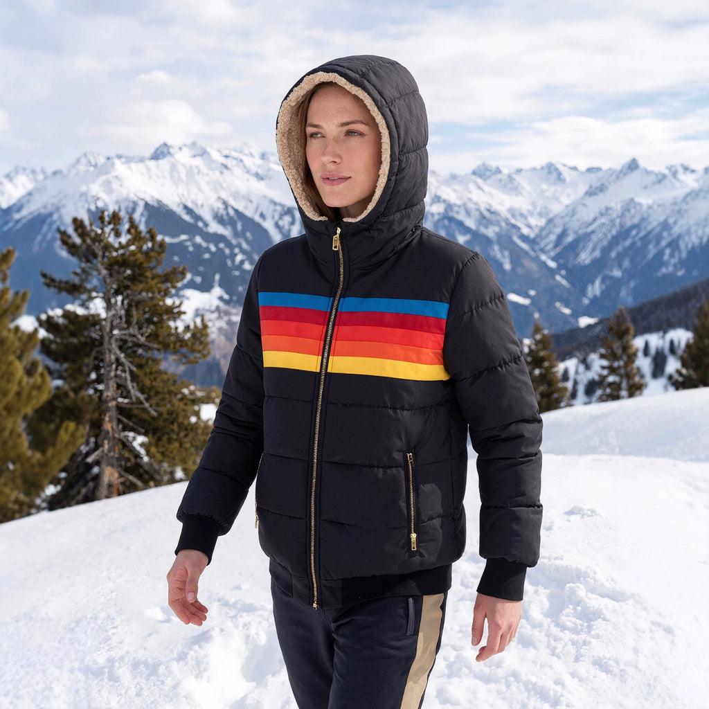 Women’s black hooded puffer jacket with sherpa-lined hood and retro rainbow stripe