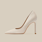 Women’s white pointed toe stiletto high heels with slender heel, side profile