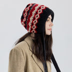 Fair Isle knit earflap bonnet with long ties, black with red and cream pattern