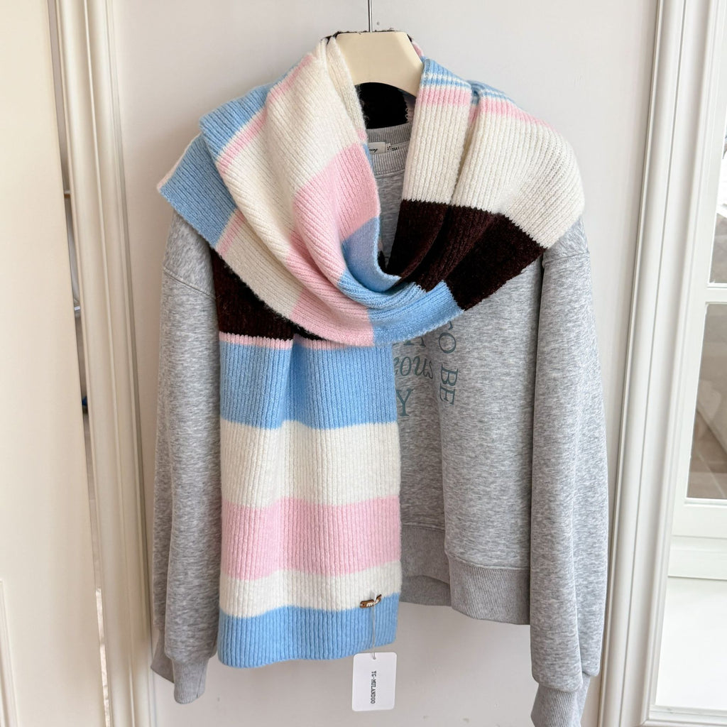 Women’s long striped wool scarf with wide pastel stripes in pink and light blue, ribbed knit.