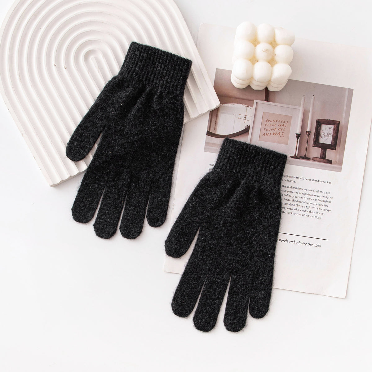 Dark gray knit winter gloves with ribbed cuffs and five-finger design