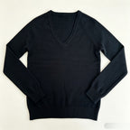 Women’s black V-neck fine-knit sweater with long sleeves and ribbed cuffs