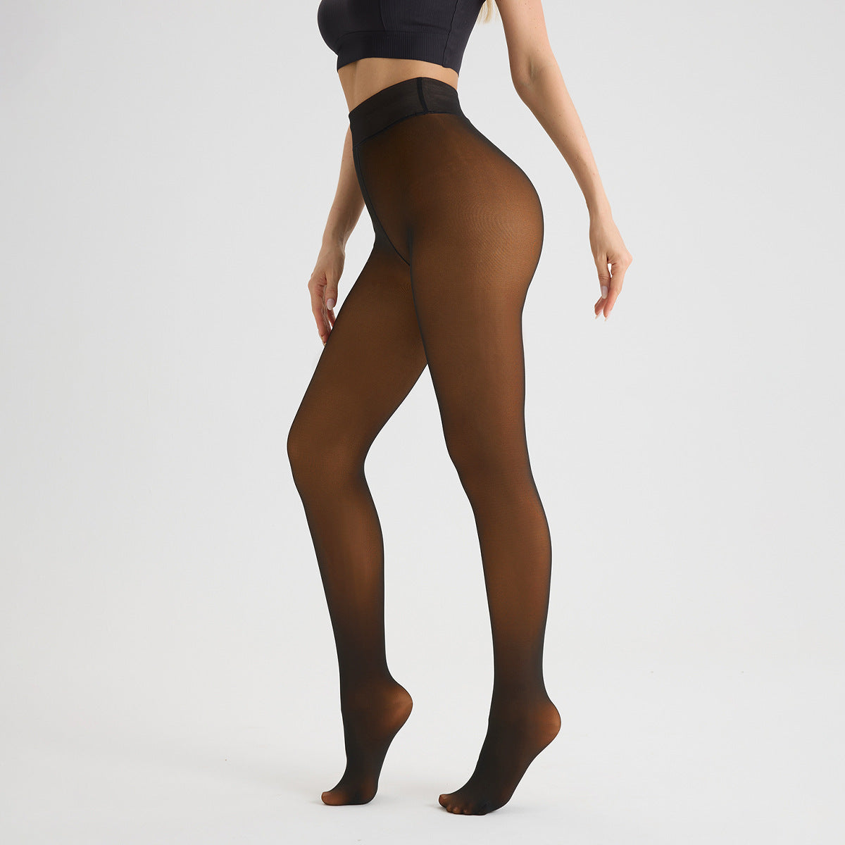 Brown sheer fleece lined tights with high waist, standing side view