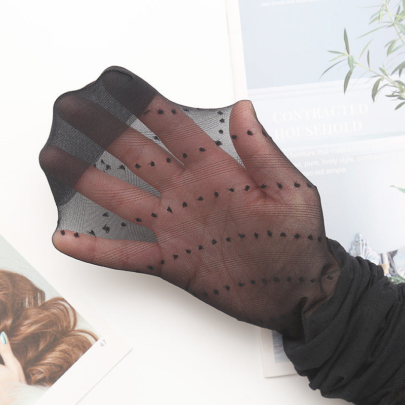 Black sheer tights with dotted stripe design, control top section visible