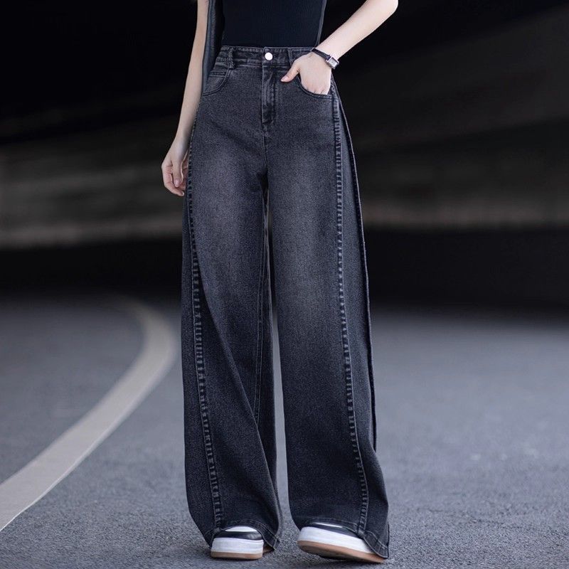Dark blue high-waisted wide-leg jeans with contrast side seam detail and pockets