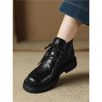 Women’s black lace-up ankle boots with round toe and chunky lug sole