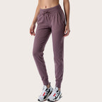Women’s mauve slim-fit performance jogger pants with drawstring waist and ankle cuffs