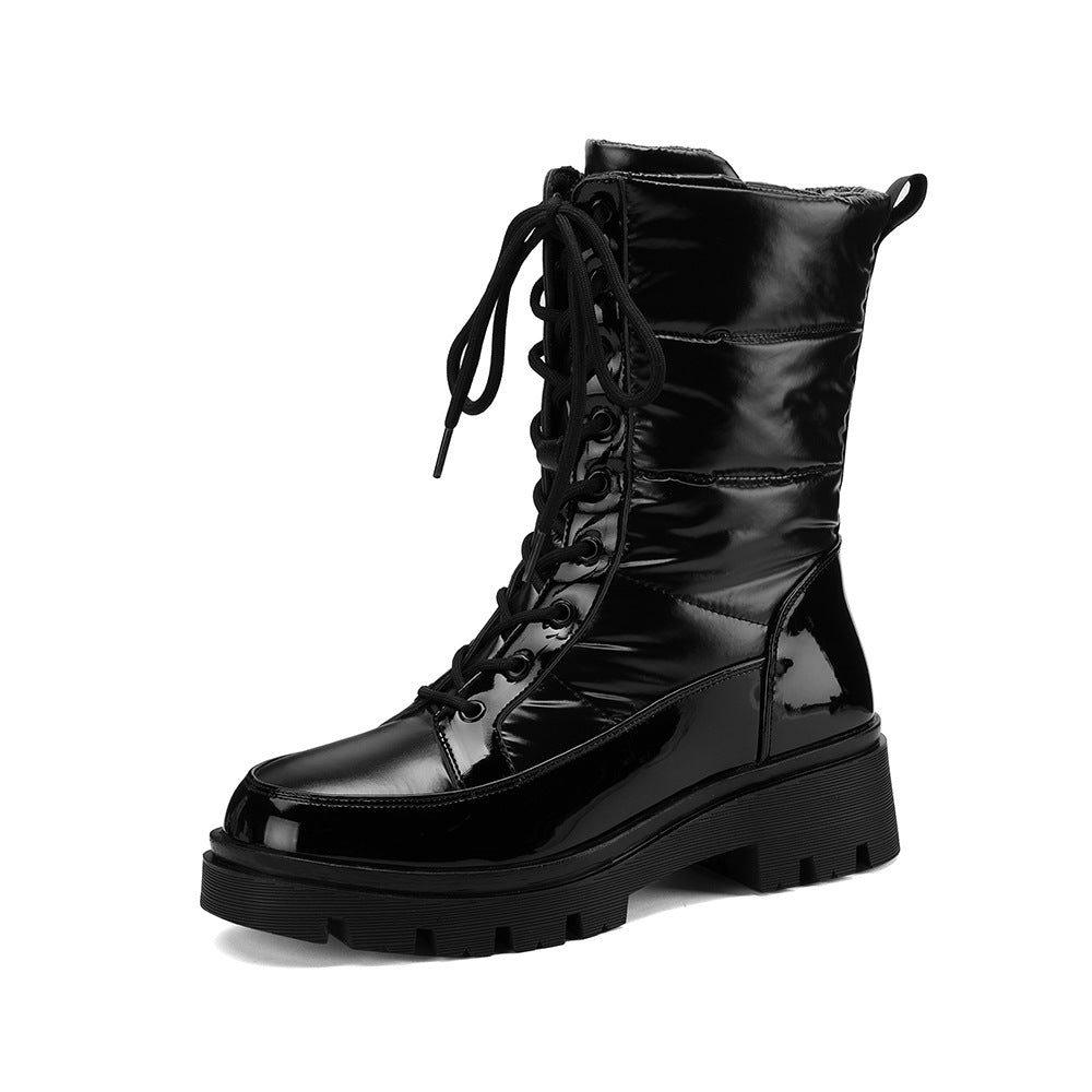 Black glossy lace-up combat boots with padded shaft and chunky lug sole