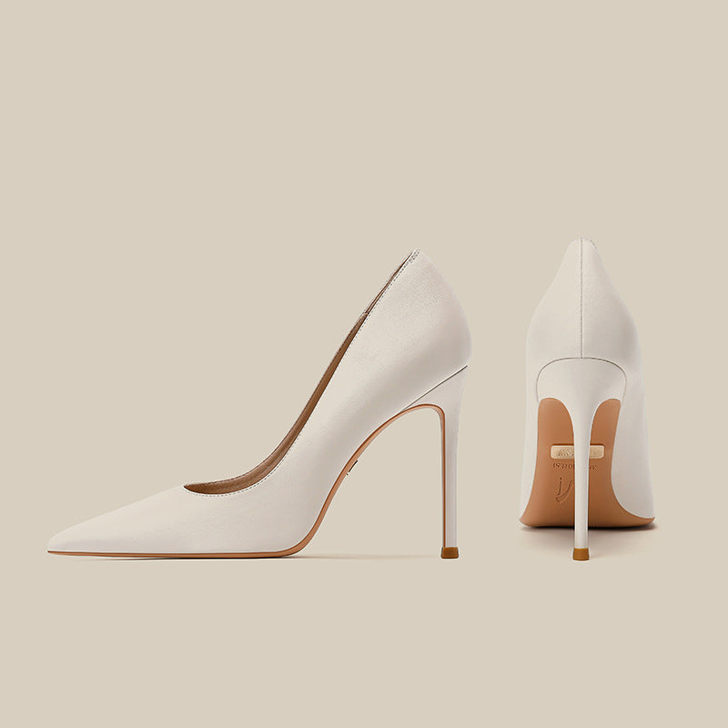 Women’s white pointed toe stiletto heels with slender heel, front and back view