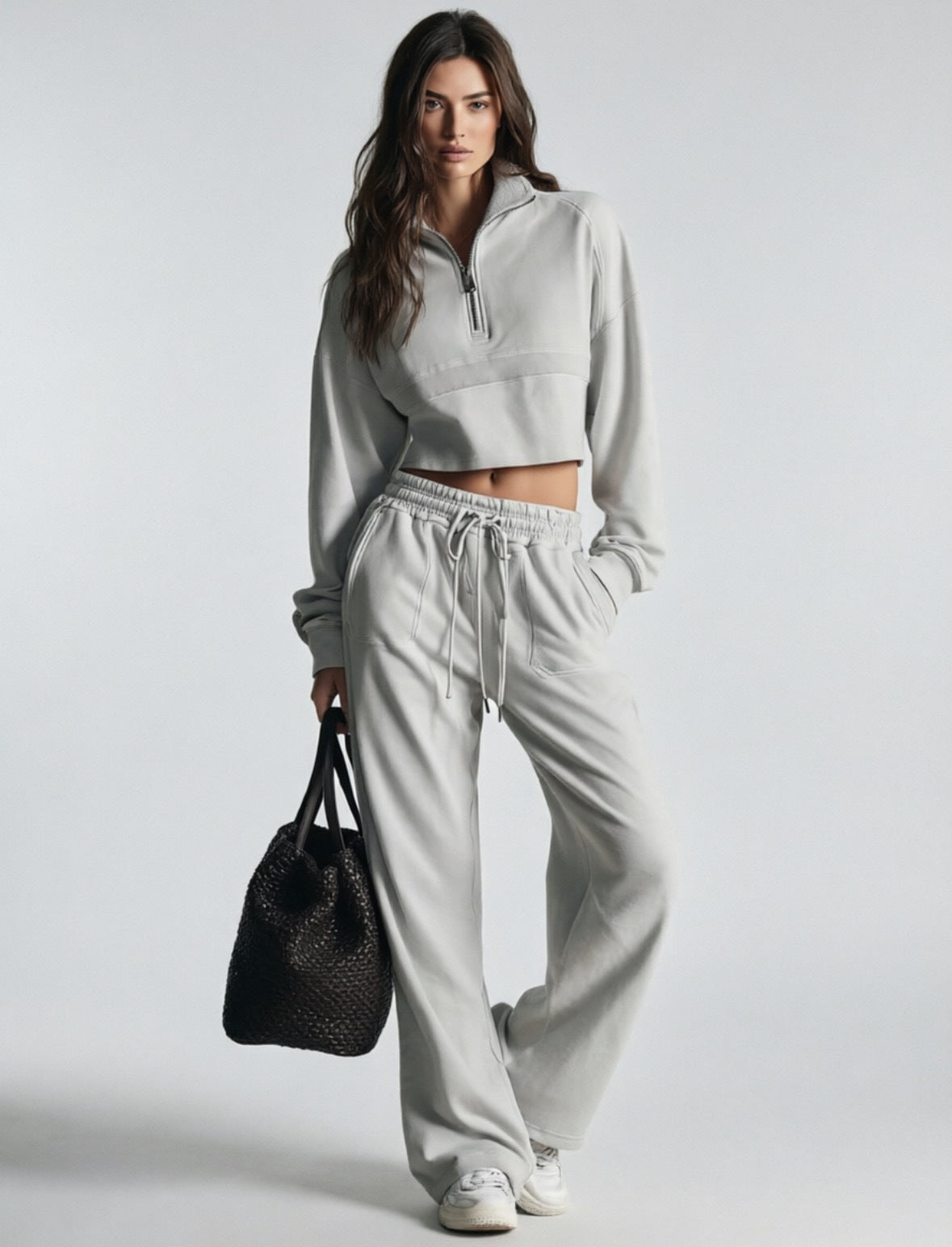 Light gray women's sweatsuit with cropped half-zip sweatshirt and wide-leg drawstring pants