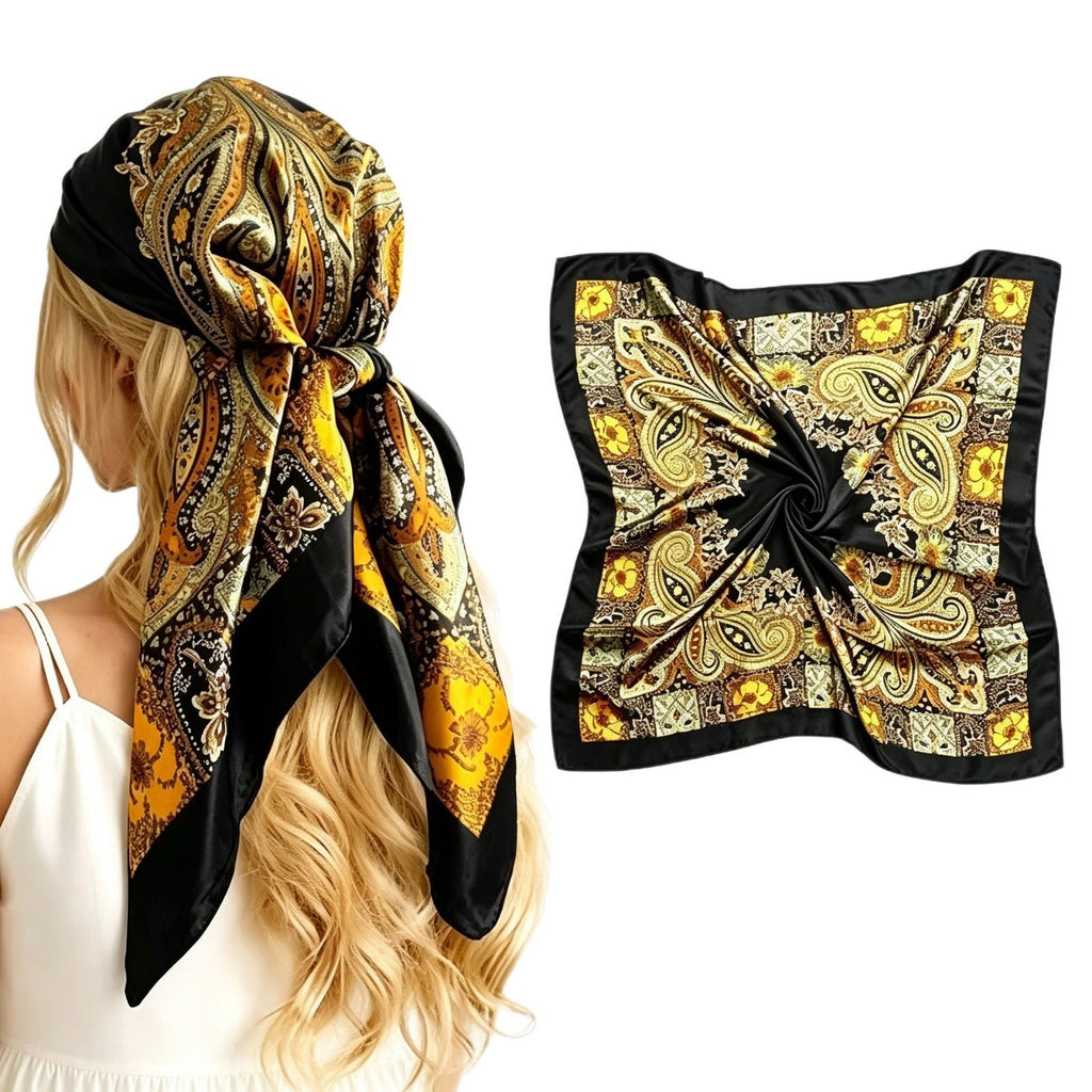 Large satin square scarf in black with gold and orange paisley print, tied head wrap