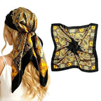 Large satin square scarf in black with gold and orange paisley print, tied head wrap