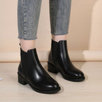 Black chelsea ankle boots with chunky block heel, round toe, pull-on style