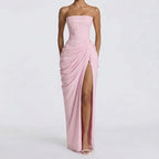 Strapless light pink maxi dress with ruched bodice, draped wrap front and high slit