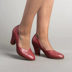 Red leather pumps with closed toes, V-cut openings, and block heels