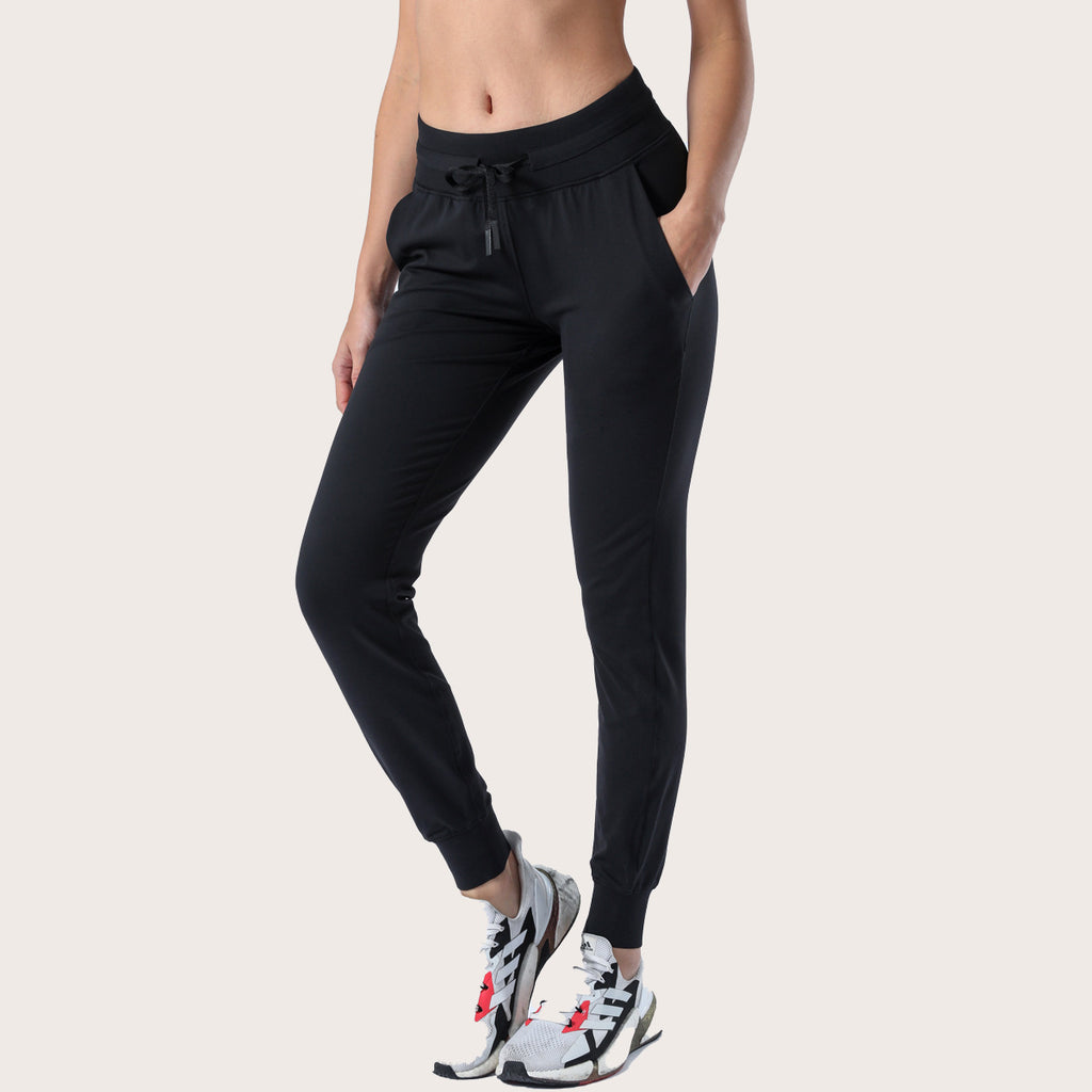 Women’s black slim-fit performance jogger pants with drawstring waist and ankle cuffs