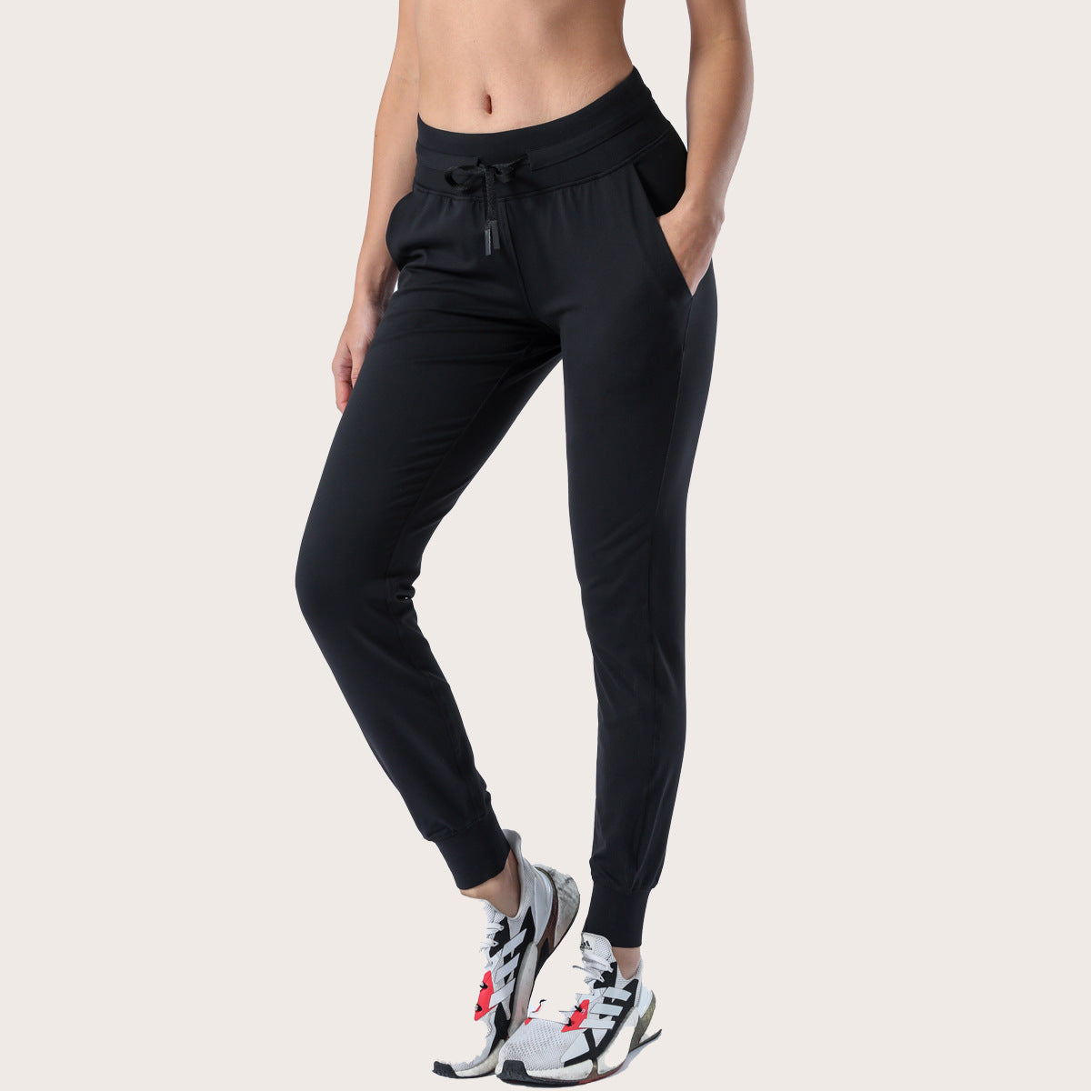 Women’s black slim-fit performance jogger pants with drawstring waist and ankle cuffs