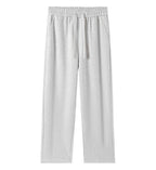 Women’s light gray wide-leg sweatpants with drawstring waistband and side pockets