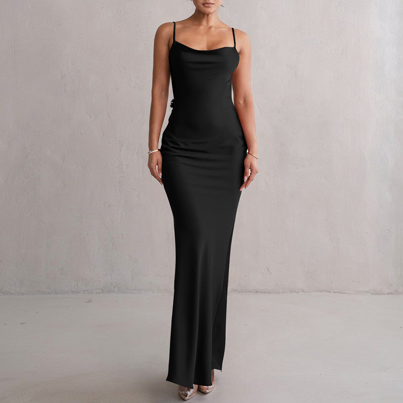 Black satin maxi dress with thin straps and cowl neckline, fitted slip silhouette.