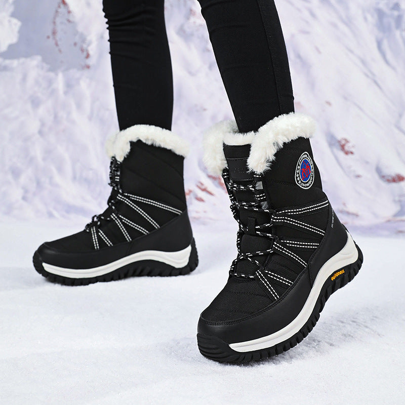 Women’s black lace-up snow boots with faux fur trim and chunky lug sole, mid-calf
