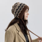 Fair Isle knit bonnet with earflaps, brown and cream pattern, long tie cords