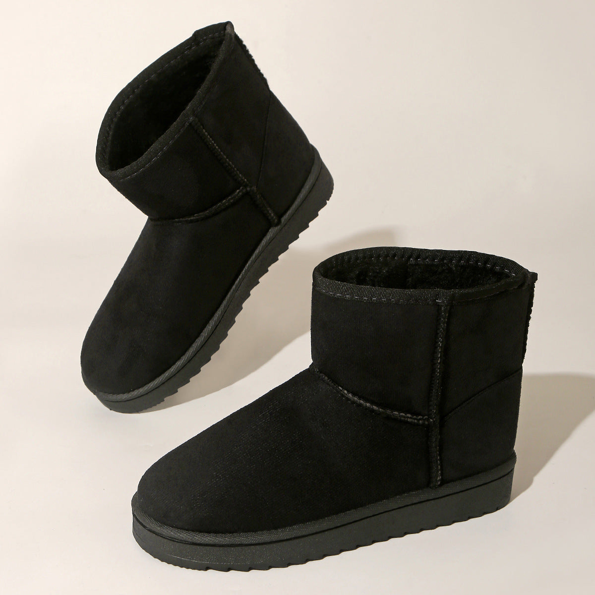 Black suede-look ankle boots with round toe, plush collar lining and flat rubber sole