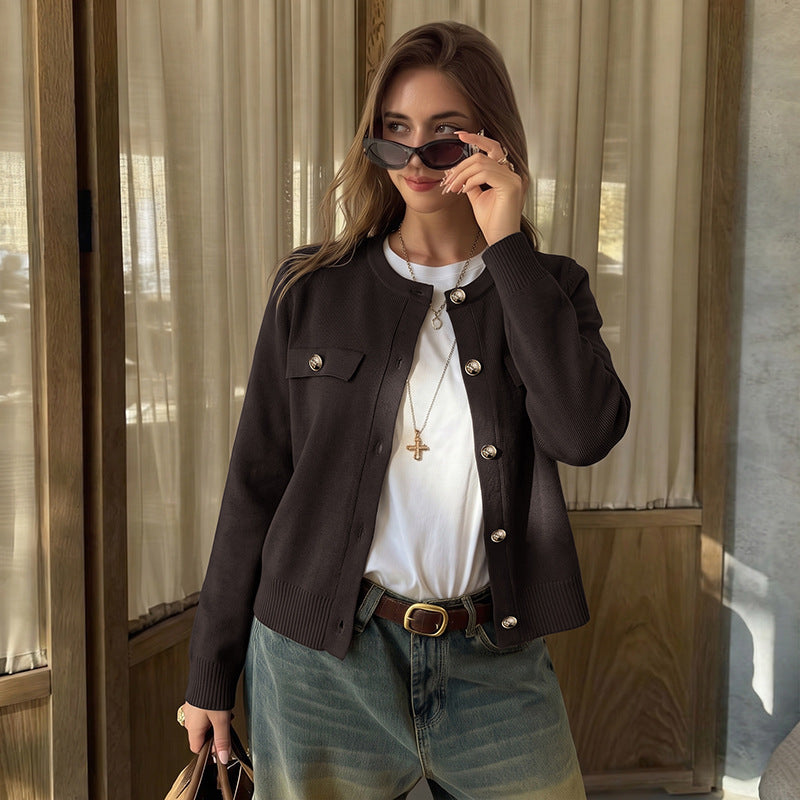 Dark brown cropped knit cardigan with gold buttons, flap pockets, crew neck, ribbed cuffs